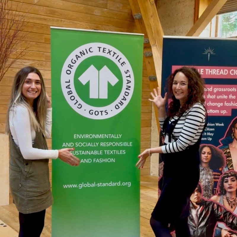 Two women with a banner