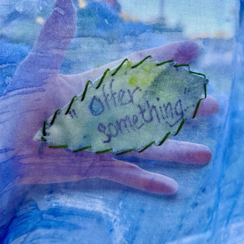 A blue image of a hand 