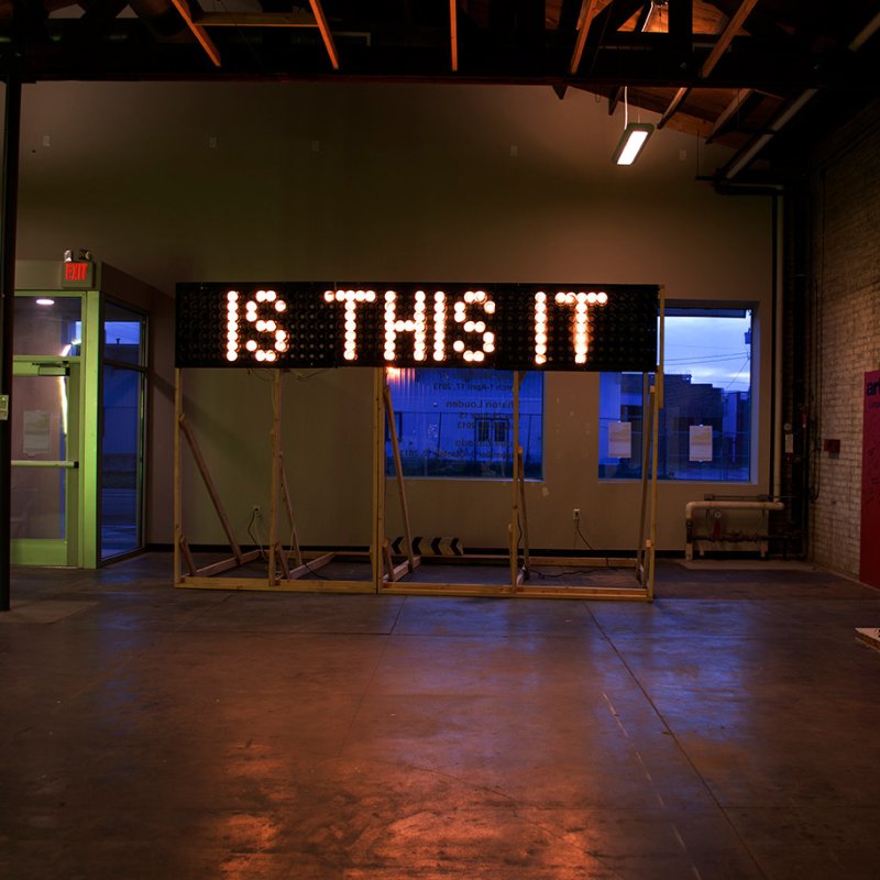 Andy Webster work photo depicting text reading "Is This It"