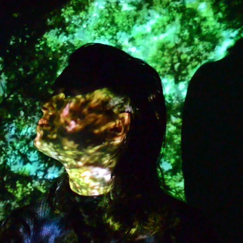 Dark photograph of person with patterned overlay