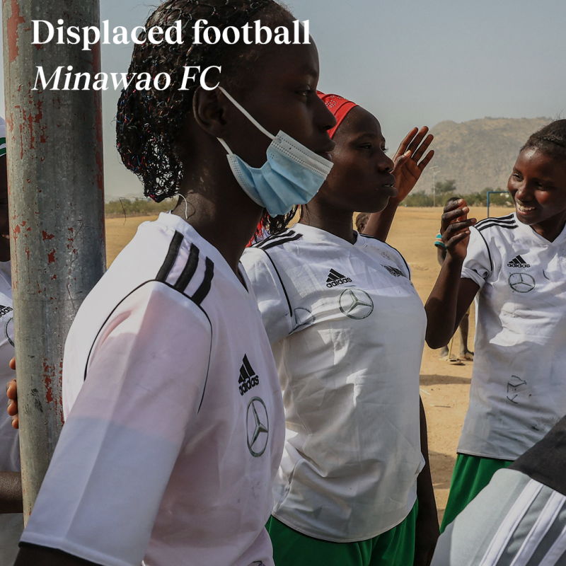 Girls playing football with 'displaced football' title