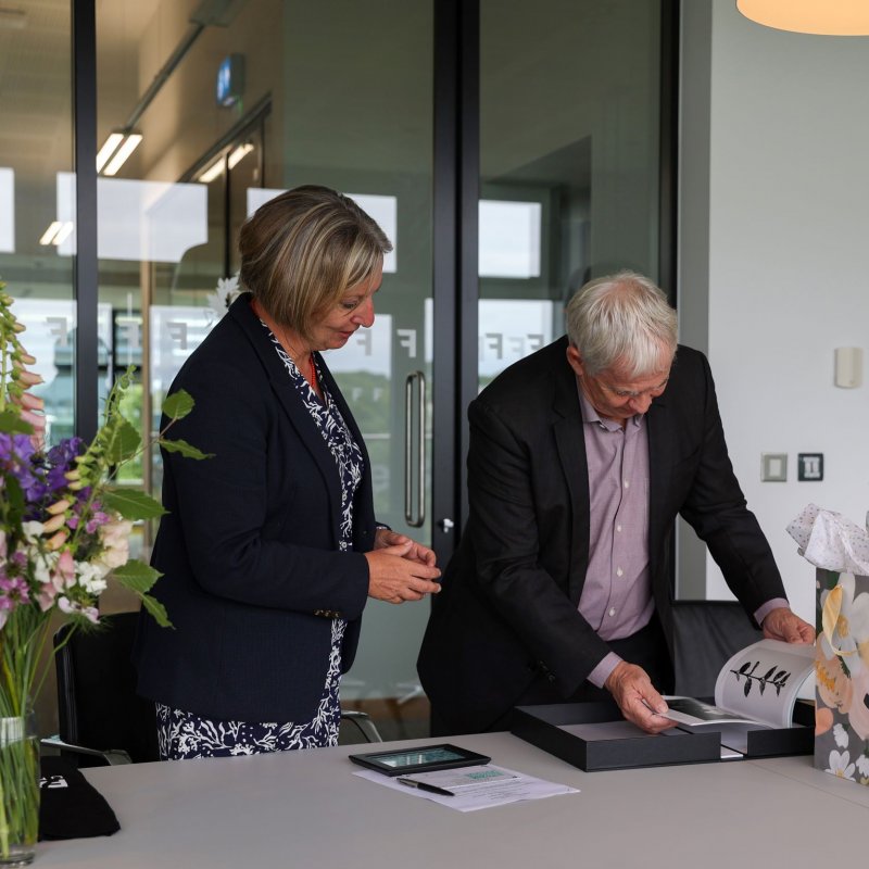 Falmouth's Vice Chancellor and LASALLE's president sharing gifts over a table