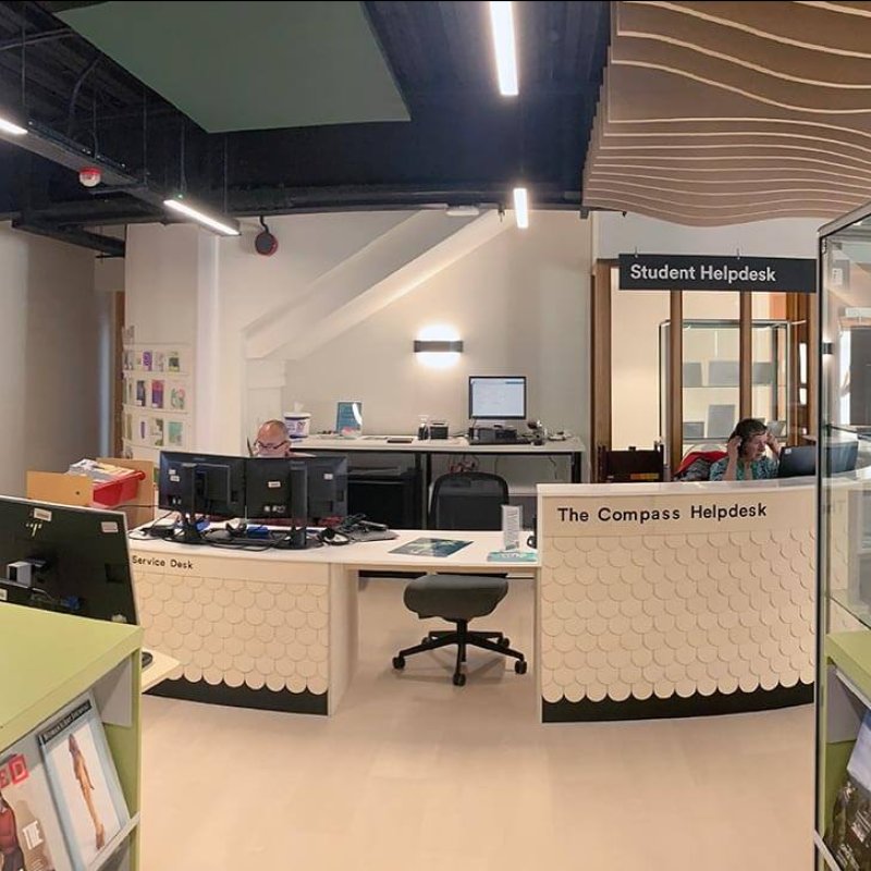 View of The Compass Help Desk at Falmouth Campus library