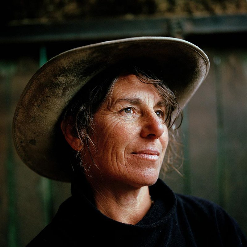Head and shoulders portrait of woman in cowboy hat
