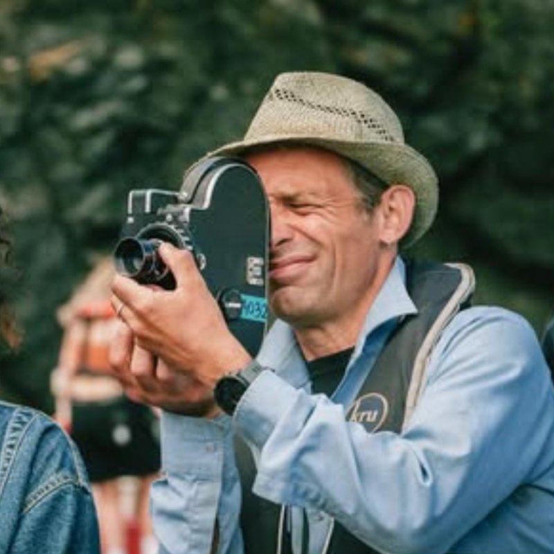Mark Jenkin holding a camera and Rosalind Eleazar on set of Rose of Nevada