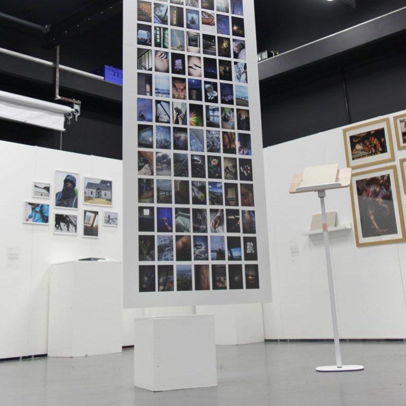 multiple photographs displayed on a tall panel