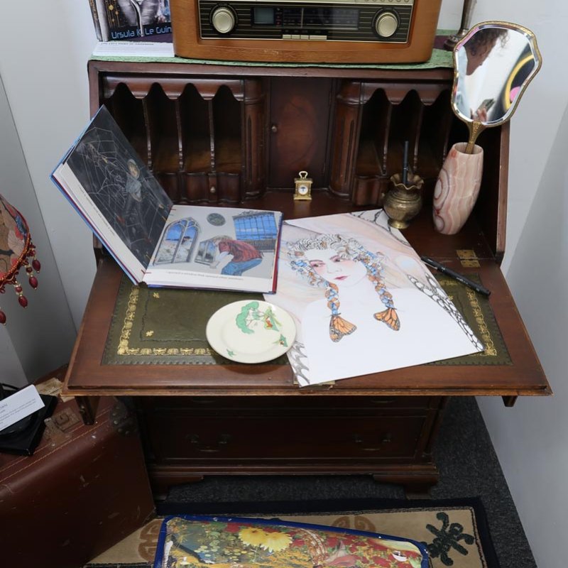 Artwork displayed on a writing bureau