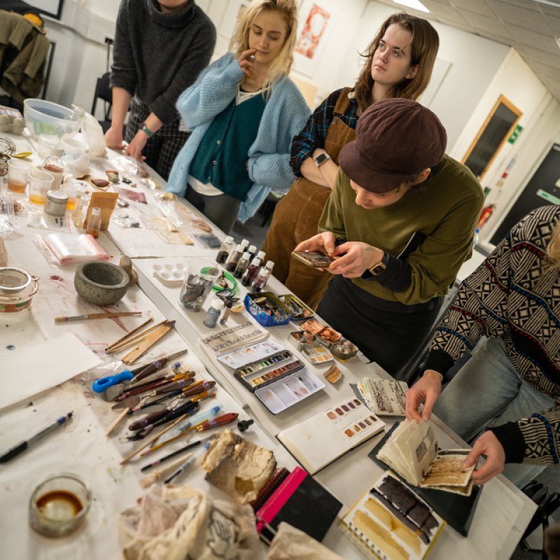 Students painting in a workshop at Falmouth Illustration Festival 