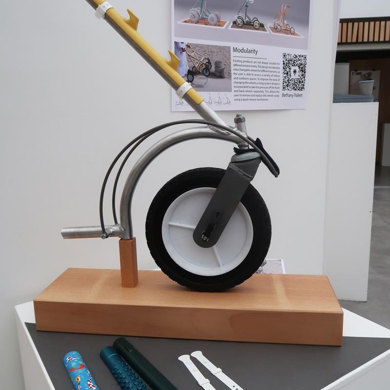 Metal rod with a wheel on display