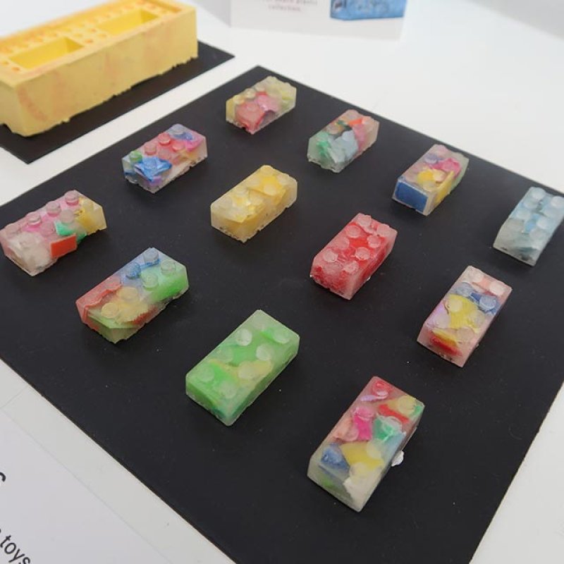Multicoloured bricks on a black surface
