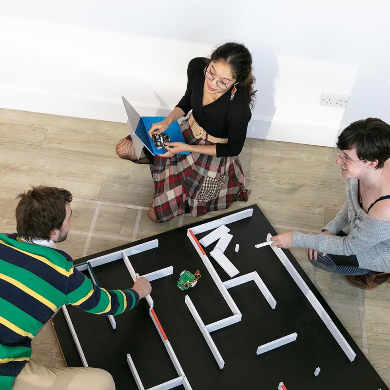 Three Robotics students working at Falmouth University