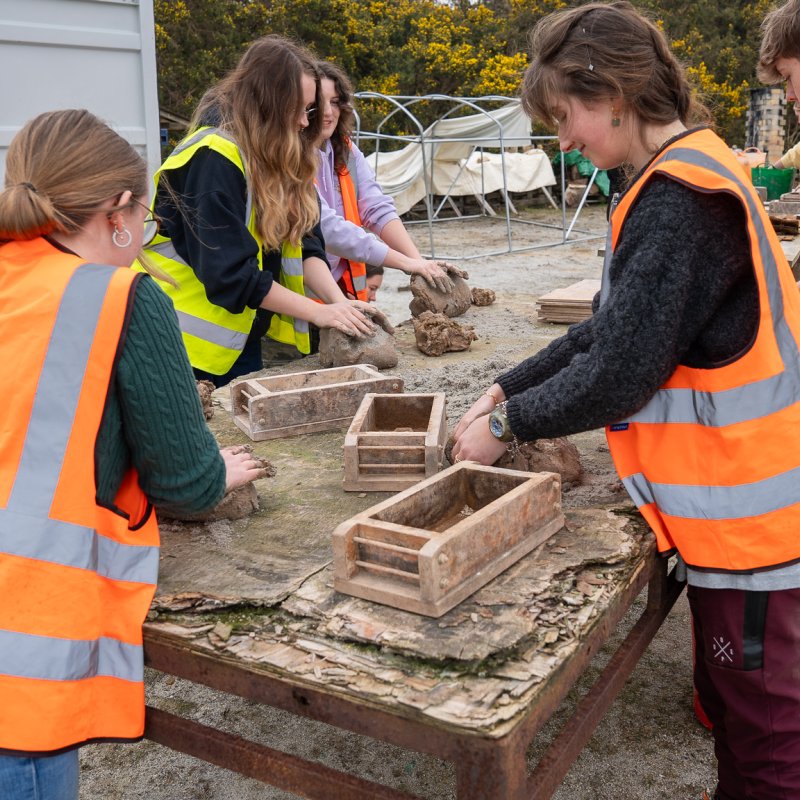 Students at a brickworks