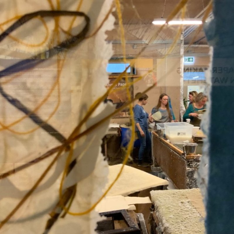 A distance shot of people in a lab