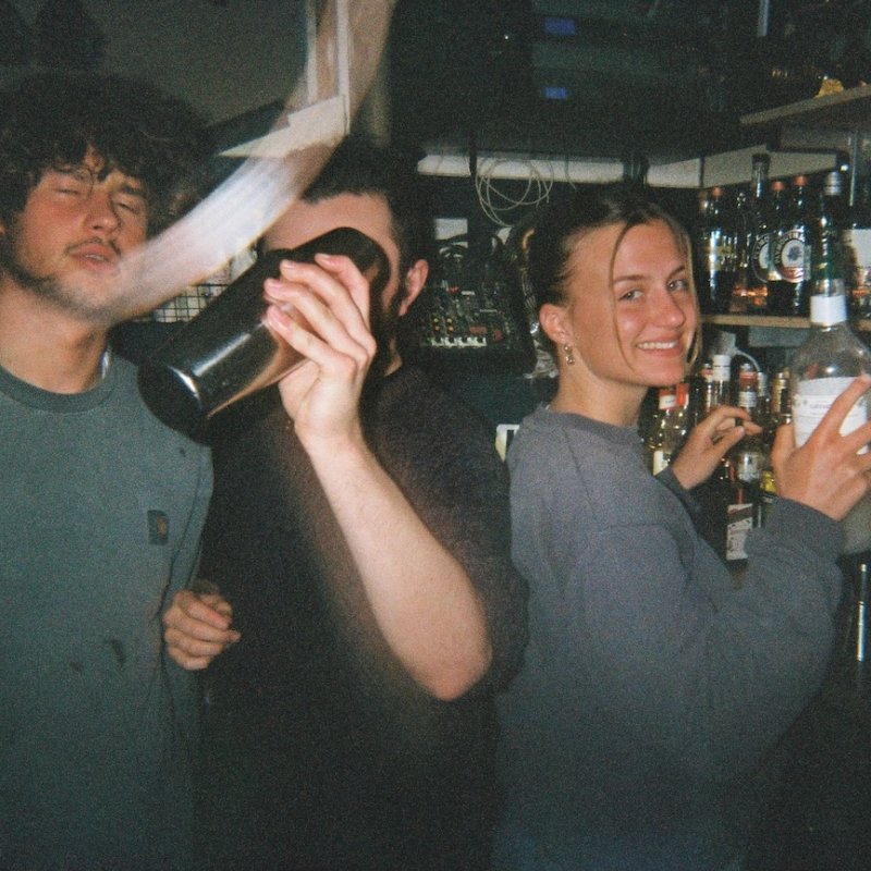 Three people working behind the bar at Small Ships in Falmouth