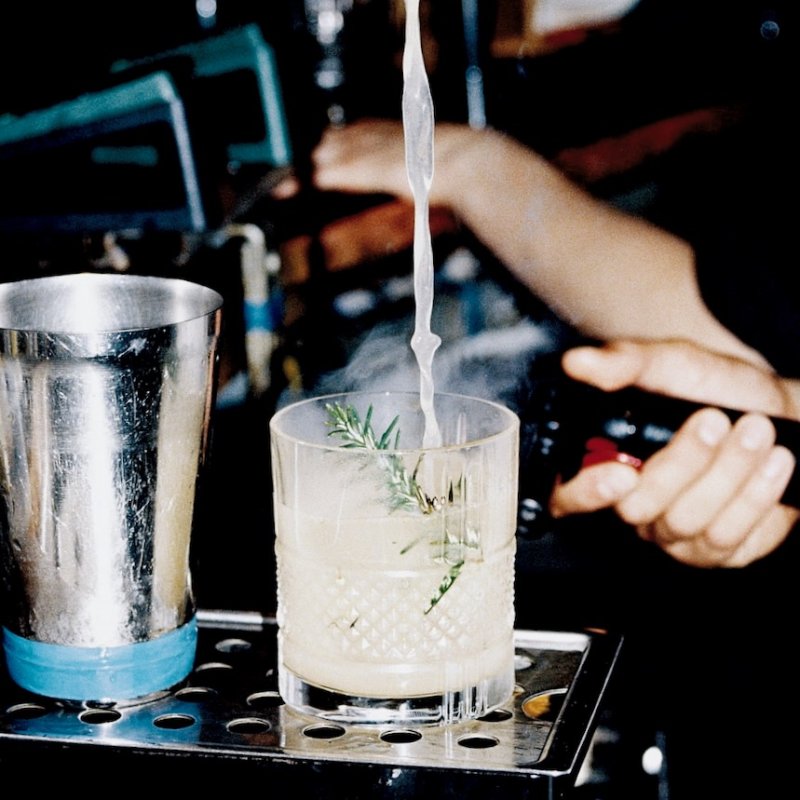 Alcohol from a cocktail shaker being poured into a glass at Small Ships in Falmouth