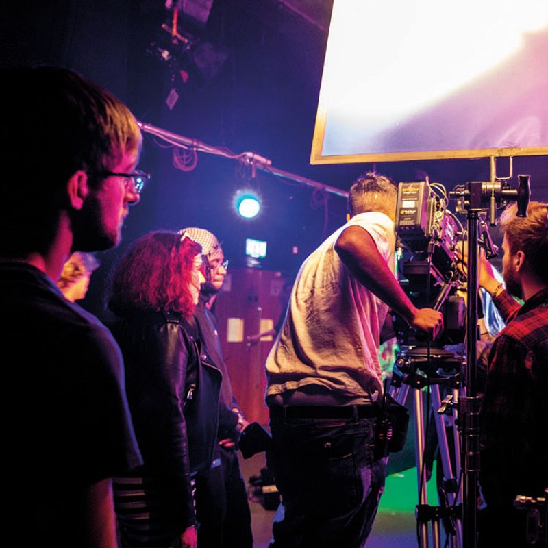 Students filming in a studio
