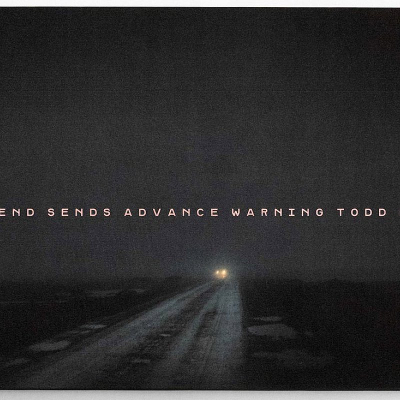 Todd Hido book cover of a car driving down a quiet road at night