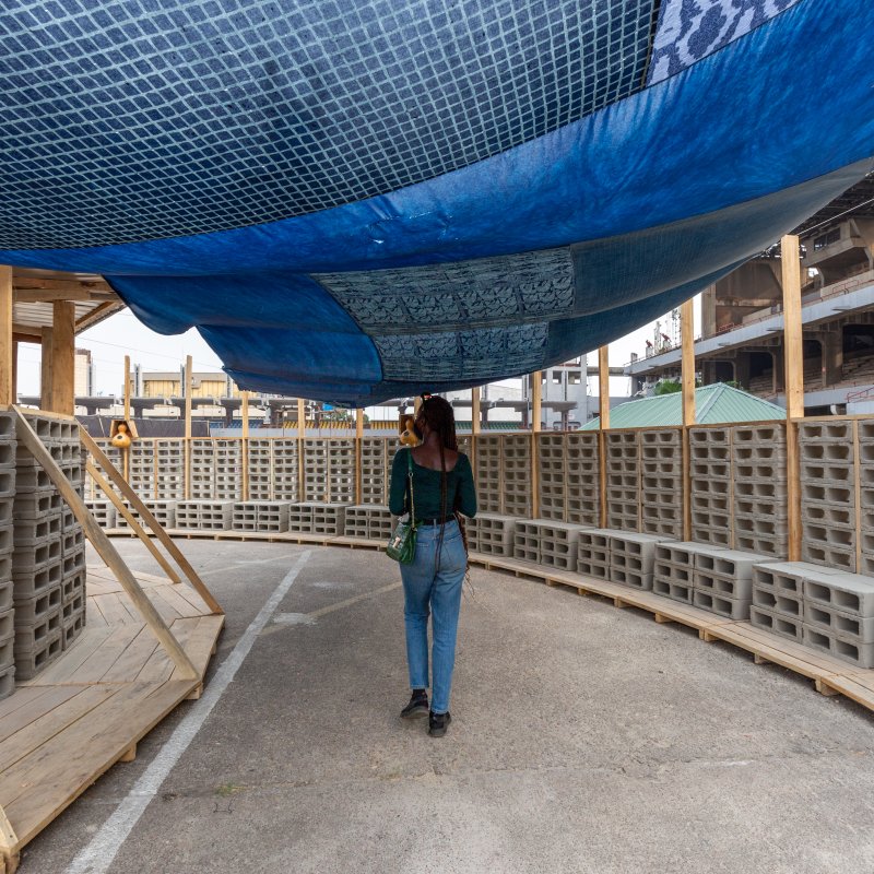 A woman walking through an art installation