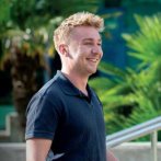 A man smiling into the camera