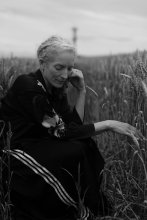 A woman sat in a field