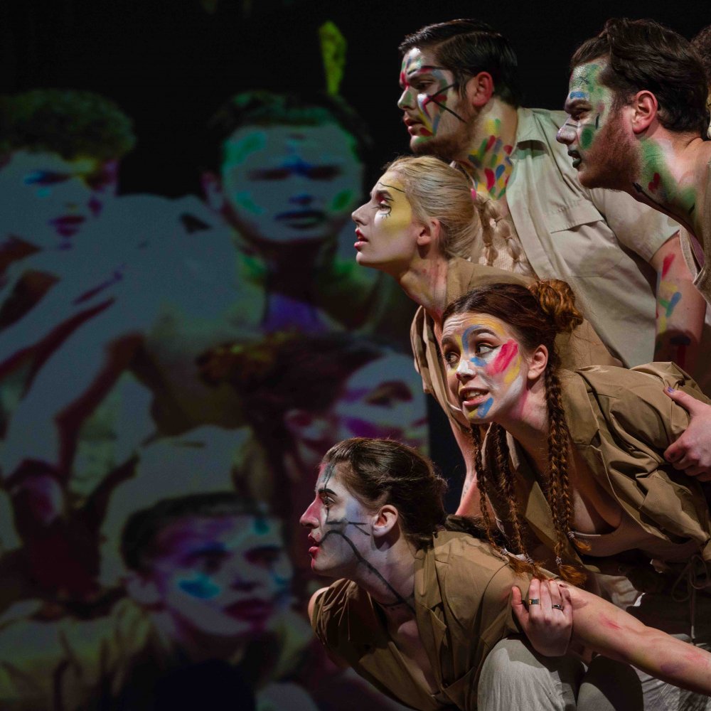 A group of acting students on stage