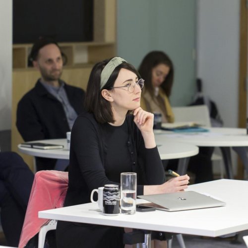 MA Comedy Writing student Anna Calandra sat at a desk