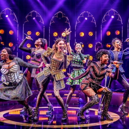 The cast for Six the musical pose on stage