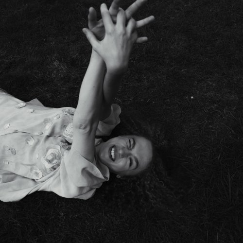 A girl lying in a field