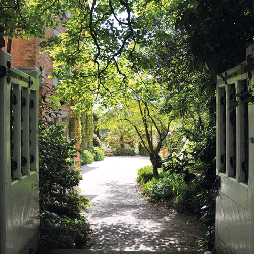 The view through the gates of the garden on Falmouth campus