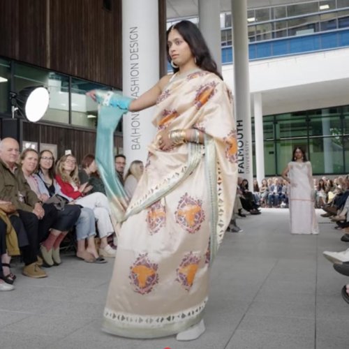 A woman wearing a sari at the Falmouth University Graduate Fashion Show 2025