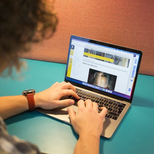 An online student working on a laptop