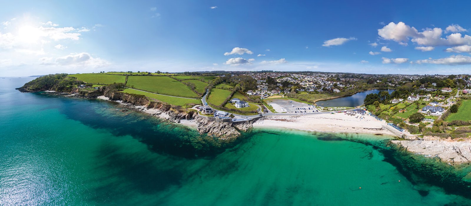 Aerial View Of Swanpool Beach with sea and cliffs