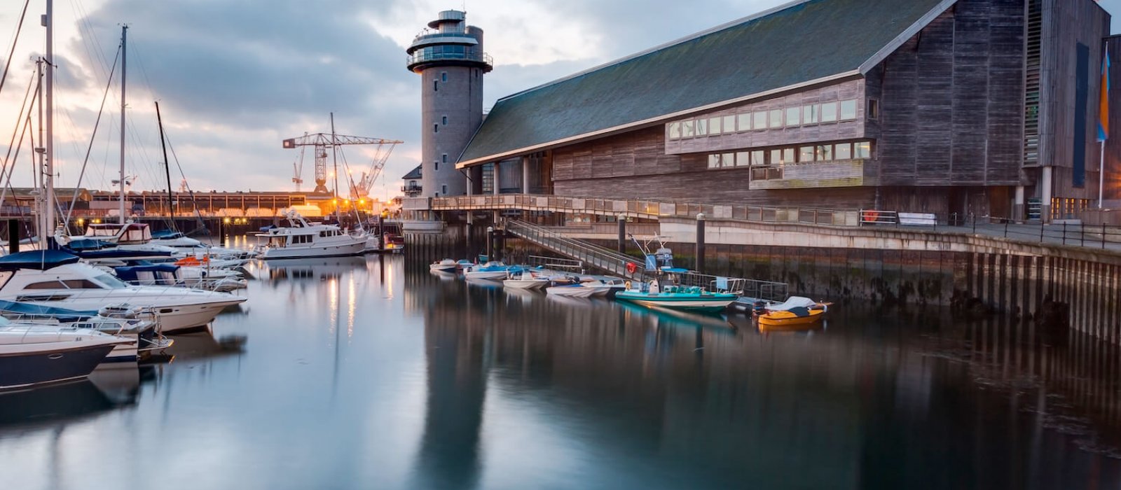 View of the National Maritime Museum in Falmouth with boats and harbour in the foreground