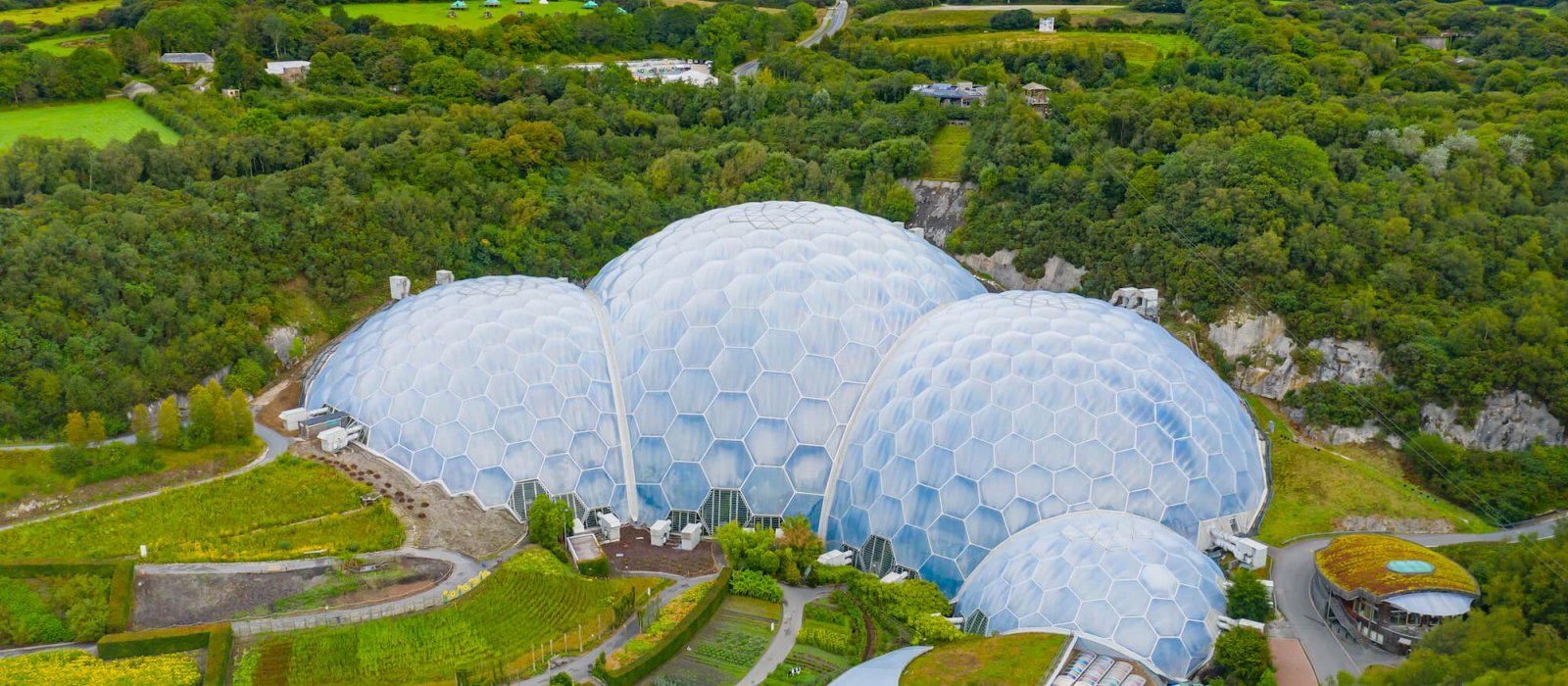 Aerial view of the Eden Project domes with fields and sky