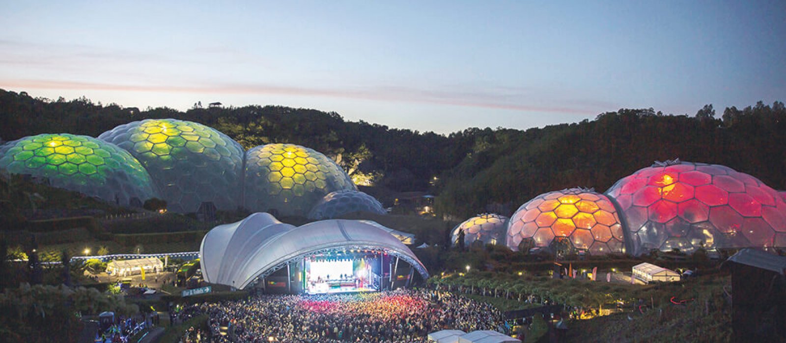 Aerial view of the Eden Project's domes lit up during an Eden Session's event.