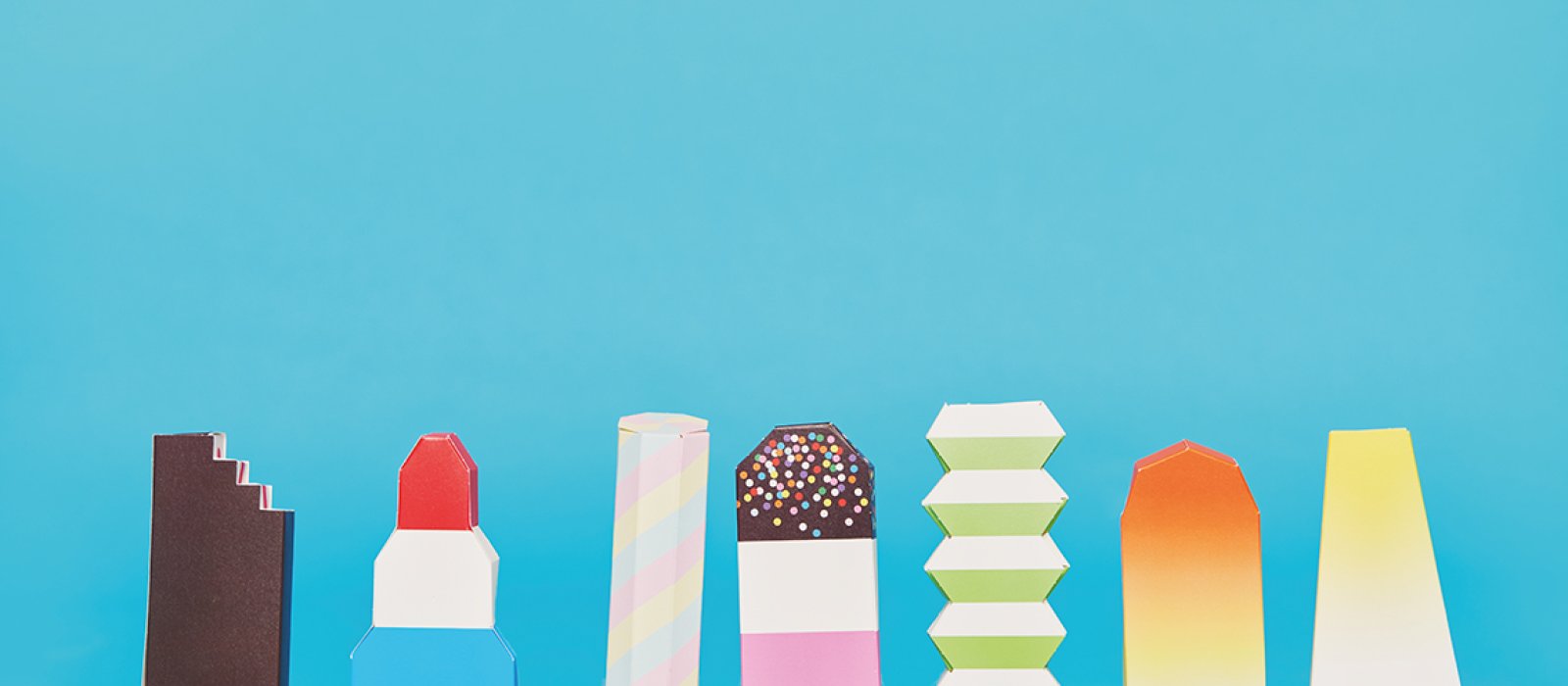 Illustrations of different ice lollies on a blue background