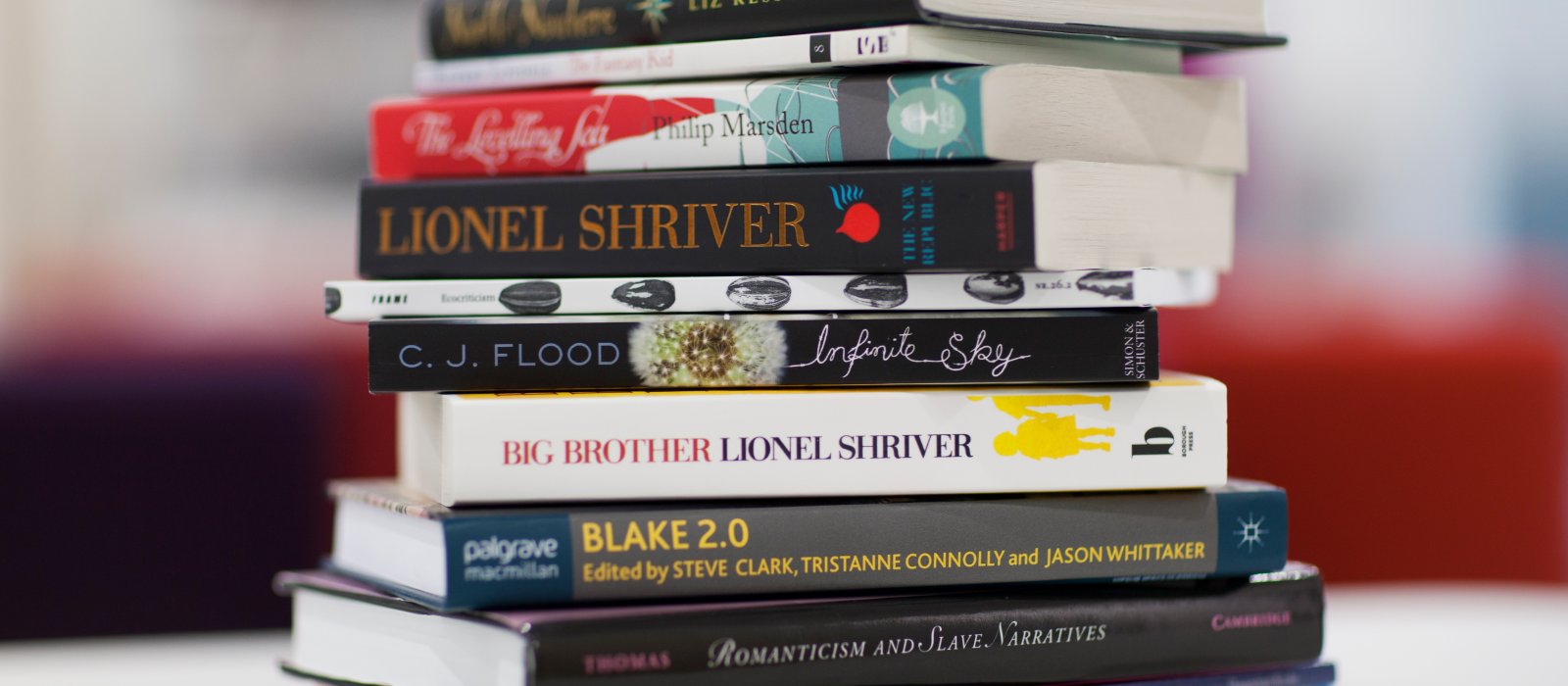 Pile of books by the writers in residence that have been at Falmouth.