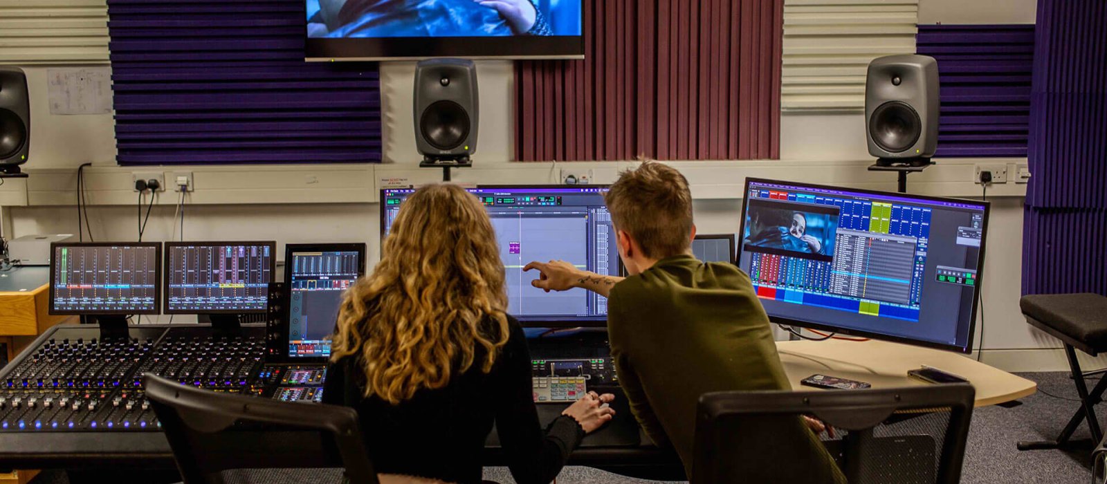 Two film students in a dubbing suite at Falmouth University