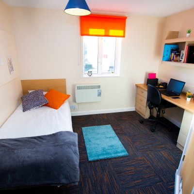 Single bedroom with desk at Tuke House halls of residence