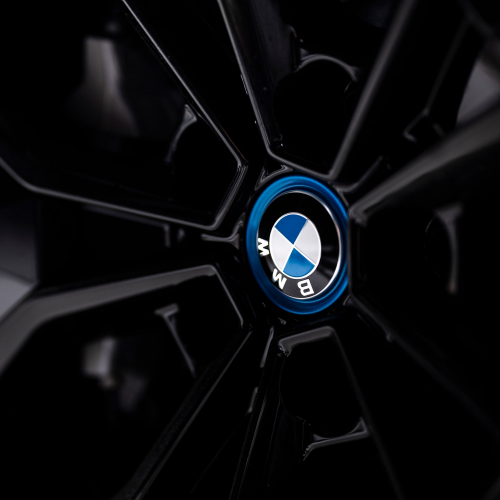 The BMW iX3 wheel shot - close up on logo
