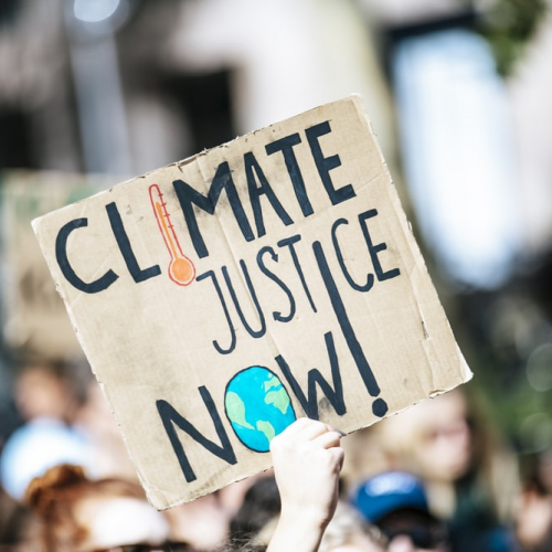 Climate Justice Now Image of protest placard reads 'Climate Justice Now'