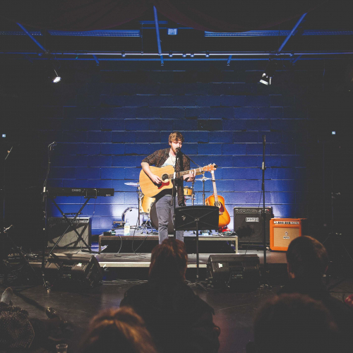 Falmouth Live Lounge A guitarist performs on stage