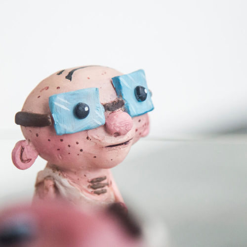 Animation BA(Hons) model of a bald man wearing large blue glasses