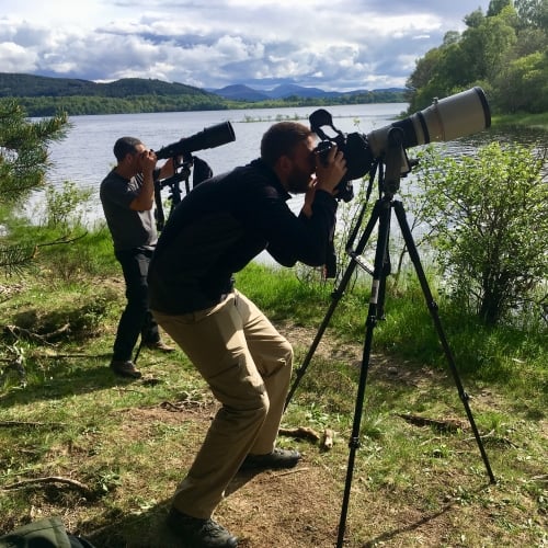 Two men with cameras on tripods