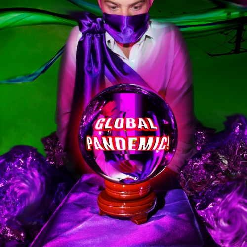Boy wearing a purple cloak with a crystal ball