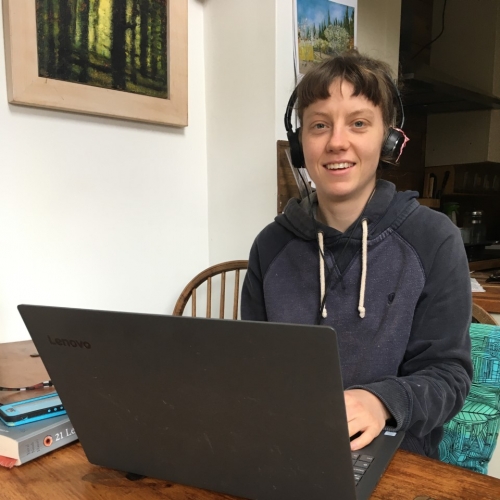 student records her contribution for the first radio show from her dining table at home