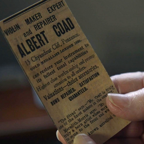 hand holding a ticket