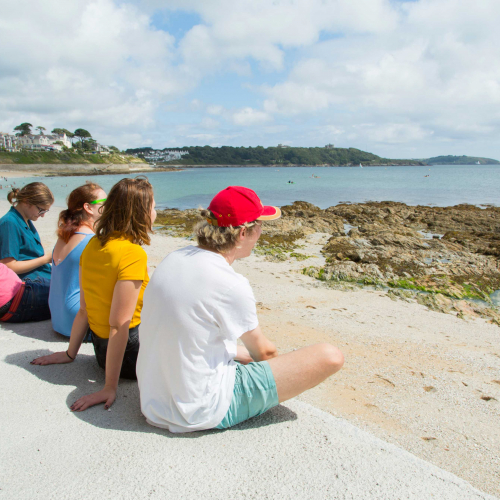 Young Carers Blog Students sat looking out to sea