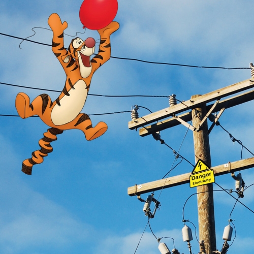 Tigger floating towards telegraph wires