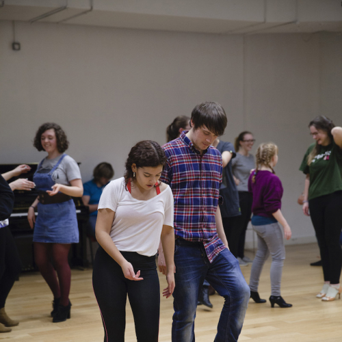 Falmouth University students learning latin dance moves.